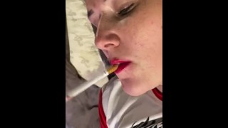 Sexy cam girl smoking and vibrating her pussy