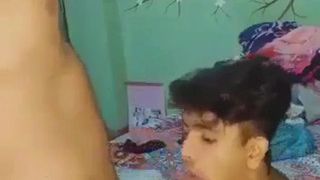 Man with man in mouth shucking